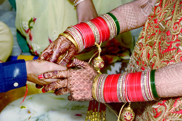 Indian couple playing Ring Fishing game in wedding ceremony of India