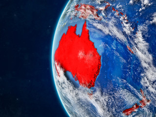 Australia from space on model of planet Earth with country borders and very detailed planet surface and clouds.