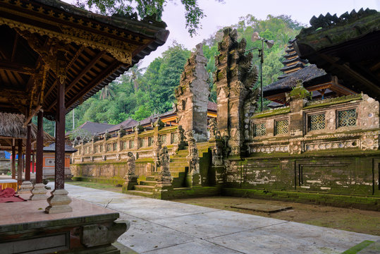 Balinese split gate and staircase entrance with stone demons, in Candi Pura Kehen hindu temple, Bali, Indonesia.