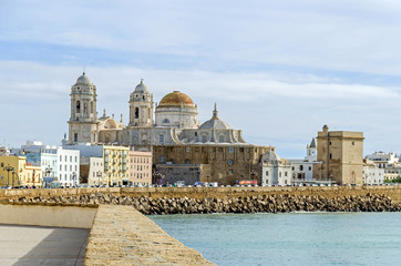 Waterfront promenade Avenida Campo del Sur and the Cadiz Cathedral in Cadiz, Spain