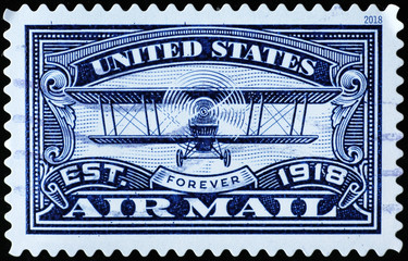 Old biplane on american air mail postage stamp