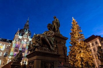 christmas time in graz,the capital of styria,austria. christmassy illuminated townhall on the main square (Hauptplatz) of the city of graz with christmas tree and the memorial for erzherzog johann 
