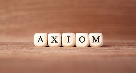 Word AXIOM made with wood building blocks