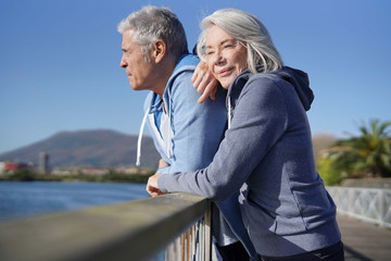  Senior couple in sportswear enjoying the sun outdoors