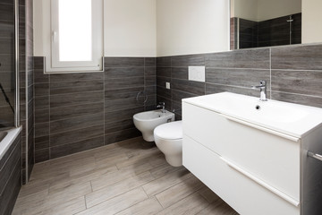 Naklejka na ściany i meble Bathroom with elegant minimalist brown tiles