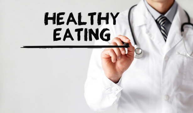 Doctor writing word Healthy Eating with marker, Medical concept