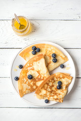 Crepes with blueberries and honey
