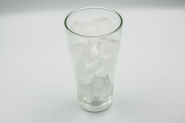 Glass of pure water with ice cubes. Isolated on white background