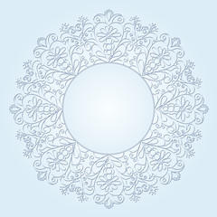 delicate round vintage frame on a light blue  background