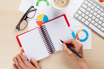 Woman working with reports and charts