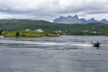 Fishing boat driving in tidal current.