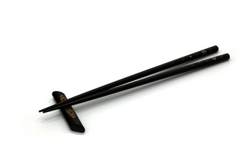 Black Japanese hashi chopsticks. Asian eating utensils.Isolated on white background.