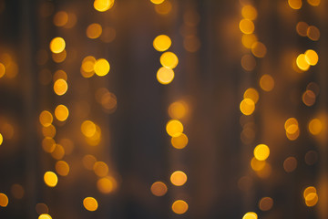 Abstract background bokeh of sparkling golden lights