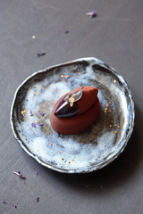 Contemporary Chocolate Violet Mousse Mini Cake, on dark grey background.
