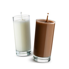 glasses full of milk and chocolate with jumping drops on white background.