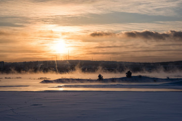 Winter Angara. The city embankment of the Angara River on a Sunday sunny winter day. Winter Irkutsk