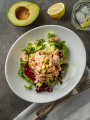 Ceviche is a traditional dish from Peru. Salmon marinated in lemon with fresh lettuce, avocado and onions