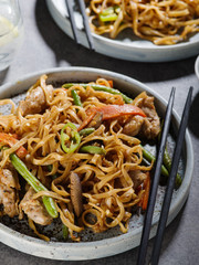 Asian noodles with pork in teriyaki sauce, with green beans, carrots and shiitake mushrooms.