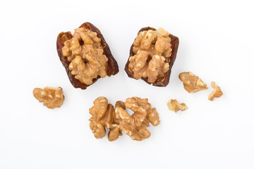 Walnuts and dried date isolated on white