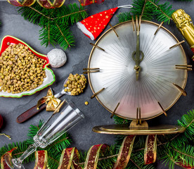 NEW YEARS EVE RITUAL. Eat spoon of lentil at midnigth. Holidey composition with vintage clock,...