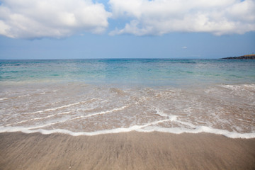 Sea wave and wet sand.The beach of Bali.