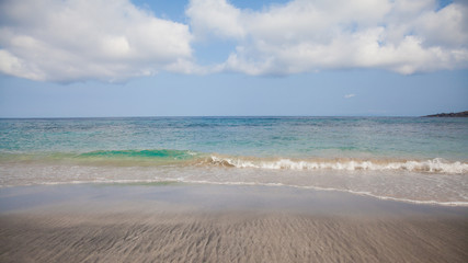 Fototapeta na wymiar Sea wave and wet sand.The beach of Bali.