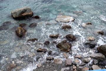 the sea was beating on the rocks