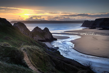 Evening sun over the river at Three Cliffs Bay, Gower, Swansea, UK
