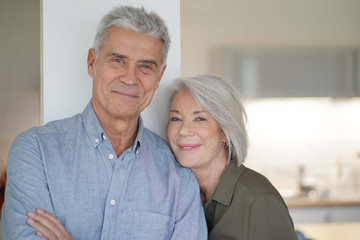  Loving portrait of happy senior couple at home