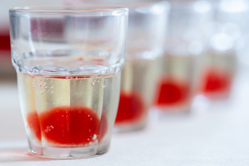 Set of alcohol shots with red syrup