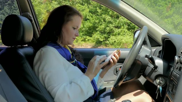 business woman driving, lost and calling