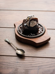 sizzling chocolate brownie is a sweet dish made using scoop of ice-cream on top served with a...