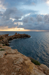 Fototapeta na wymiar Sunrise in the Cap Martinet on the island of Ibiza