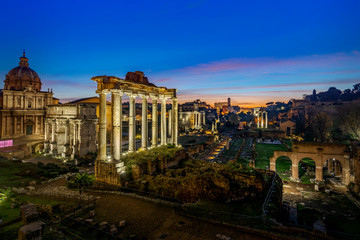 Obraz na płótnie Canvas Imperial Fora (Fori Imperiali - Imperial Forum) During the Sunrise Time. Imperial Fora is situated in the Old Rome,it is one of the most famous attraction of the Capital. With Coliseum Background.