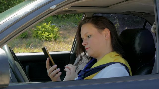 business lady driving, talking on the phone