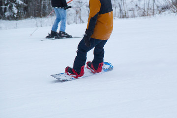 a snowboarder rides a snowboard
