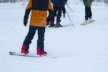 a snowboarder rides a snowboard