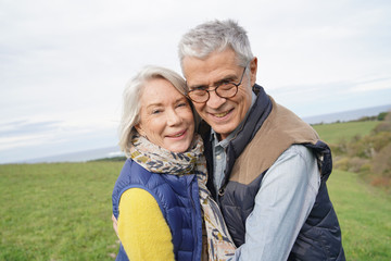 Fototapeta premium Healthy senior couple on countryside walk
