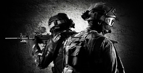 Group of fighters of a special unit covers the withdrawal of members of their team.
