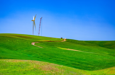 Fototapeta na wymiar wind turbine and crane