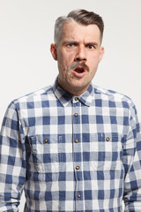 Fototapeta premium Collage of two portraits of the same old and young man. Face lifting, aging and skincare concept for men. Comparison between old and young faces. Youth and old age. Process of aging and rejuvenation