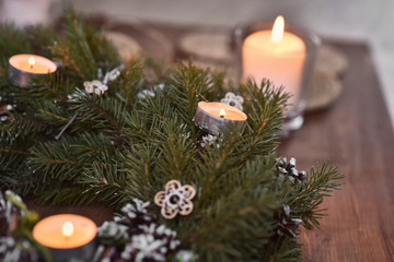 Christmas, Advent Decorative Wreath Candle Decoration. In a burning candle in a beautiful decorative wreath.