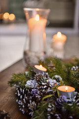 Christmas, Advent Decorative Wreath Candle Decoration. In a burning candle in a beautiful decorative wreath.