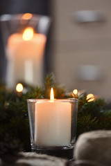 Christmas, Advent Decorative Wreath Candle Decoration. In a burning candle in a beautiful decorative wreath.