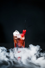 Raspberry ice cold refreshing cocktail with berries. Flat lay, Front view. Smoke envelops