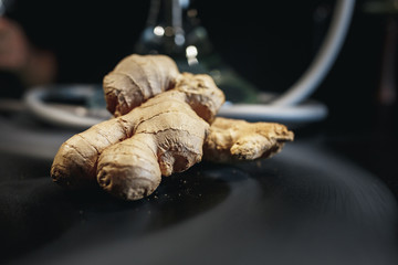 Ginger on black background. In the background are hookah and smoke.