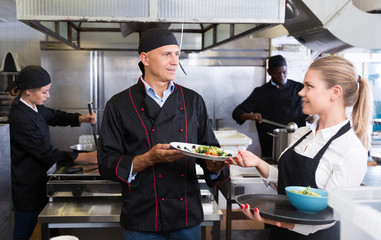 Chef with team preparing food