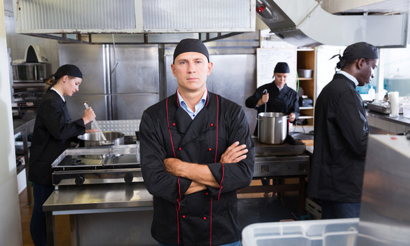 Confident chef in restaurant kitchen
