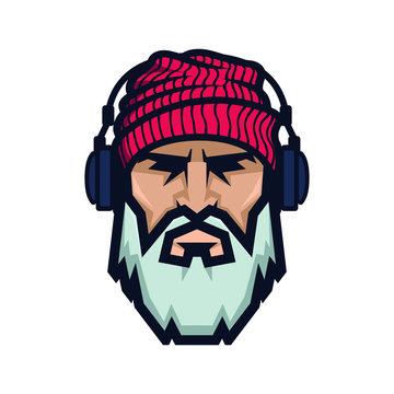 Bearded man in a knitted hat and headphones. DJ Hipster