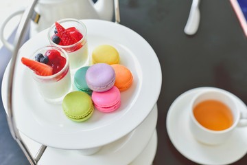 Traditional English Afternoon Tea Set with Colourful Macarons and Desserts